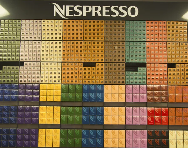 Variety of coffee capsules in Nespresso store — Stock Photo, Image
