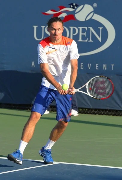Jogador profissional de tênis Alexandr Dolgopolov da Ucrânia durante a primeira rodada de duplas no US Open 2013 — Fotografia de Stock