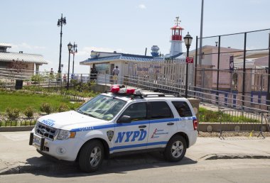 NYPD car providing security at Coney Island section of Brooklyn clipart