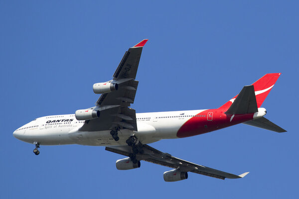 Qantas Airline Boeing 747-400 in New York sky before landing at JFK Airport