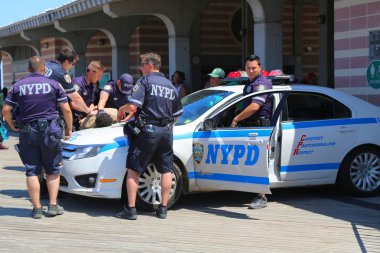 NYPD officers providing security at Coney Island Boardwalk  in Brooklyn clipart