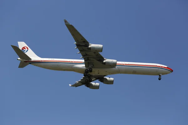 China Eastern Airlines Airbus A340 in New York sky before landing at JFK Airport