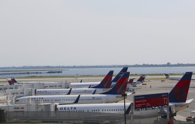 Delta Airlines aircraft at the gates at the Terminal 4 at John F Kennedy International Airport clipart