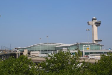 Delta Airline Terminal 4 and Air Traffic Control Tower at John F Kennedy International Airport in New York clipart