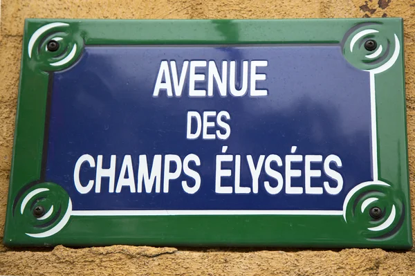 Avenue des champs-Elysées ulice podepsat v Paříži, Francie. — Stock fotografie