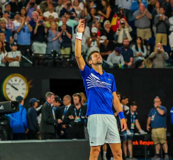 MELBOURNE, AUSTRALIA - 27 Ocak 2019: Sırbistan Grand Slam şampiyonu Novak Cokoviç, Melbourne Park 'ta oynanan 2019 Avustralya Açık' ta Rafael Nadal ile oynadığı final maçı sonrasında zaferini kutladı 