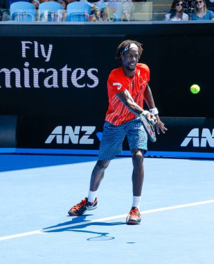 MELBOURNE, AUSTRALIA - JANUARY 24, 2016: Professional tennis player Gael Monfis of France in action during  2016 Australian Open round 4 match  in Melbourne Park