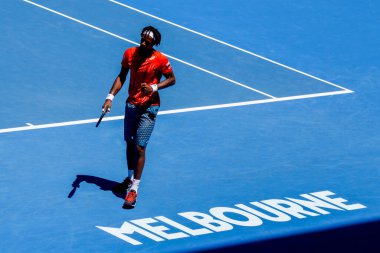 MELBOURNE, AUSTRALIA - JANUARY 24, 2016: Professional tennis player Gael Monfis of France in action during  2016 Australian Open round 4 match  in Melbourne Park