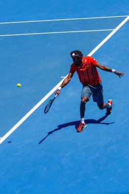 MELBOURNE, AUSTRALIA - JANUARY 24, 2016: Professional tennis player Gael Monfis of France in action during  2016 Australian Open round 4 match  in Melbourne Park