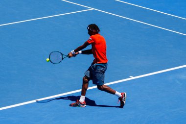 MELBOURNE, AUSTRALIA - JANUARY 24, 2016: Professional tennis player Gael Monfis of France in action during  2016 Australian Open round 4 match  in Melbourne Park