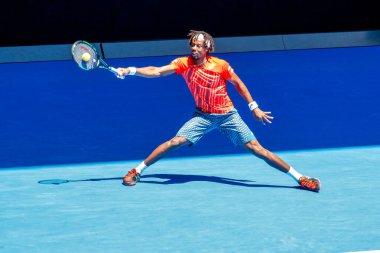 MELBOURNE, AUSTRALIA - JANUARY 24, 2016: Professional tennis player Gael Monfis of France in action during  2016 Australian Open round 4 match  in Melbourne Park