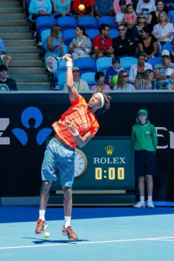 MELBOURNE, AUSTRALIA - JANUARY 24, 2016: Professional tennis player Gael Monfis of France in action during  2016 Australian Open round 4 match  in Melbourne Park