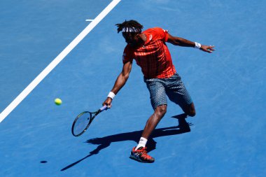 MELBOURNE, AUSTRALIA - JANUARY 24, 2016: Professional tennis player Gael Monfis of France in action during  2016 Australian Open round 4 match  in Melbourne Park