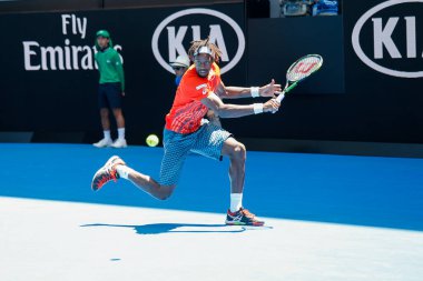 MELBOURNE, AUSTRALIA - JANUARY 24, 2016: Professional tennis player Gael Monfis of France in action during  2016 Australian Open round 4 match  in Melbourne Park