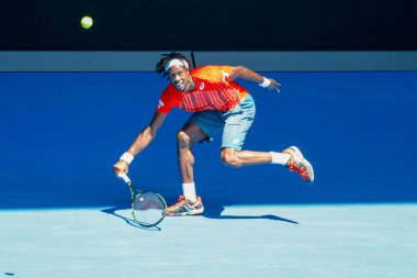 MELBOURNE, AUSTRALIA - JANUARY 24, 2016: Professional tennis player Gael Monfis of France in action during  2016 Australian Open round 4 match  in Melbourne Park