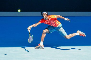 MELBOURNE, AUSTRALIA - JANUARY 24, 2016: Professional tennis player Gael Monfis of France in action during  2016 Australian Open round 4 match  in Melbourne Park