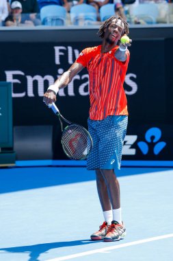 MELBOURNE, AUSTRALIA - JANUARY 24, 2016: Professional tennis player Gael Monfis of France in action during  2016 Australian Open round 4 match  in Melbourne Park