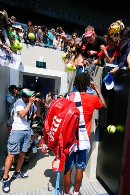 MELBOURNE, AUSTRALIA - JANUARY 24, 2016: Professional tennis player Gael Monfis of France signs autographs at Margaret Court Arena after victory at 2016 Australian Open round 4 match in Melbourne Park