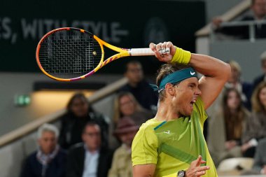 PARIS, FRANCE - MAY 31, 2022: Grand Slam champion Rafael Nadal of Spain in action during his quater-final match against Novak Djokovic of Serbia at Roland Garros 2022 in Paris, France clipart
