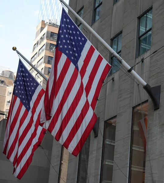 View of American flags on building background