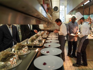 REIMS, FRANCE - MAY 26, 2022: Sous chef Umada Hideaki at the Two Star Michelin and Relais Chateaux award-winning Restaurant Le Parc at the Domaine Les Crayeres, a classic French hotel in Reims