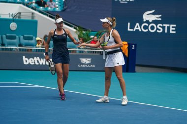 MIAMI GARDENS, FLORIDA - APRIL 3, 2022: Tennis players Veronika Kudermetova of Russia and Elise Mertens of Belgium in action during their women's doubles final match at 2022 Miami Open at the Hard Rock Stadium in Miami Gardens, Florida