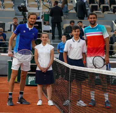 PARIS, FRANCE - MAY 30, 2022: Grand Slam Champions Daniil Medvedev of Russia (L) and Marin Cilic of Croatia by the net before their men's singles round 4 match at 2022 Roland Garros in Paris, France