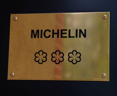TINQUEUX, FRANCE - MAY 27, 2022: Three Star Michelin Guide plaque at the Three Star Michelin L'Assiette Champenoise restaurant  run by famous Chef Arnaud Lallement in a family run hotel in a suburb of Reims, France 