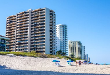 RIVIERA BEACH, FLORIDA - MARCH 29, 2022: Luxury condominiums at Singer Island, Fl. Singer Island an oceanfront neighborhood part of the city of Riviera Beach with natural beaches and upscale hotels