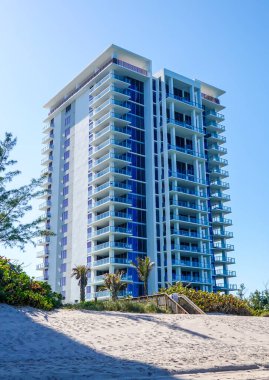 RIVIERA BEACH, FLORIDA - MARCH 29, 2022: Luxury condominiums at Singer Island, Fl. Singer Island an oceanfront neighborhood part of the city of Riviera Beach with natural beaches and upscale hotels