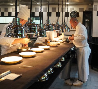 TINQUEUX, FRANCE - MAY 27, 2022: Three Michelin star chef Arnaud Lallement plating at the Three Star Michelin L'Assiette Champenoise restaurant in Champagne Region, France