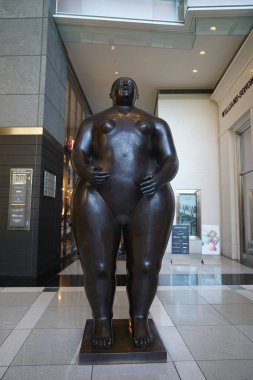 NEW YORK - AUGUST 20, 2022: The 12-foot-tall sculpture of Eve, work of Colombian artist Fernando Botero, at the Shops at Columbus Circle, Time Warner Center, New York City