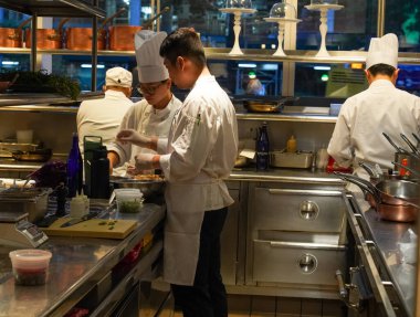 NEW YORK - AUGUST 20, 2022: In kitchen of a Two Michelin Stars Jean-Georges restaurant by French chef Jean-Georges Vongerichten in Manhattan