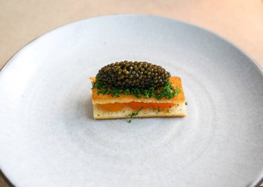 Egg Toast with Caviar and Herbs in gourmet restaurant