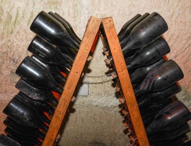 Champagne bottles in pupitre in Reims, France. Remuage, or riddling, of champagne
