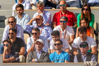 PARIS, FRANCE - MAY 31, 2022: Team Alcaraz with coach Juan Carlos Ferrero watching Carlos Alcaraz of Spain in action during his quarter-final match at 2022 Roland Garros in Paris, France