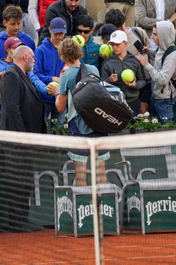 PARIS, FRANCE - MAY 30, 2022: Professional tennis player Andrey Rublev of Russia signs autographs after his round 4 match against Jannik Sinner of Italy at 2022 Roland Garros in Paris, France