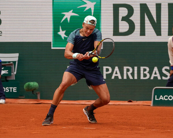 PARIS, FRANCE - MAY 30, 2022: Professional tennis player Holger Rune of Denmark in action during his round 4 match against Stefanos Tsitsipas of Greece at 2022 Roland Garros in Paris, France