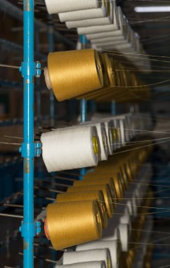 An old textile manufactory. Textile manufacturing. The work of textile processing machines.
