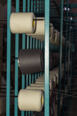 An old textile manufactory. Textile manufacturing. The work of textile processing machines.