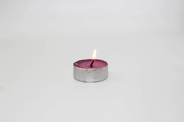 burning candle photo studio gold light of purple candle