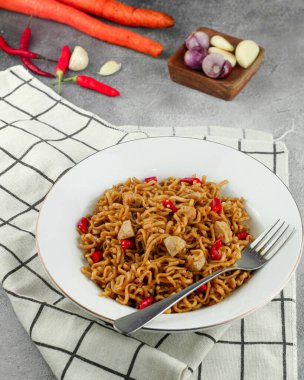 Favorite dish stir fried noodles or locally known as MIe Goreng. Selective focus.