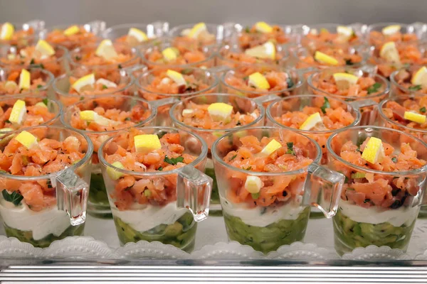 Salmon tartare with avocado puree and horseradish puree