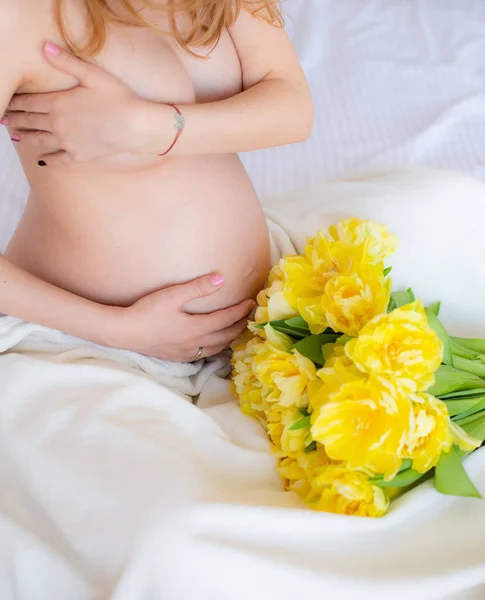 Flowers Yellow Tulips Pregnant Woman Bed Holding Bell — ストック写真