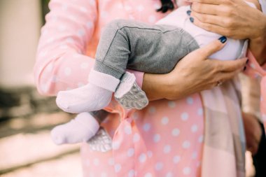 woman holds a sleeping baby tightly in her arms anxiety, experience for the life of a chil
