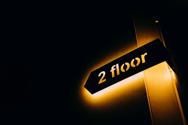 Pointer Arrow Second Floor Yellow Backlight Dark Roo — Fotografia de Stock