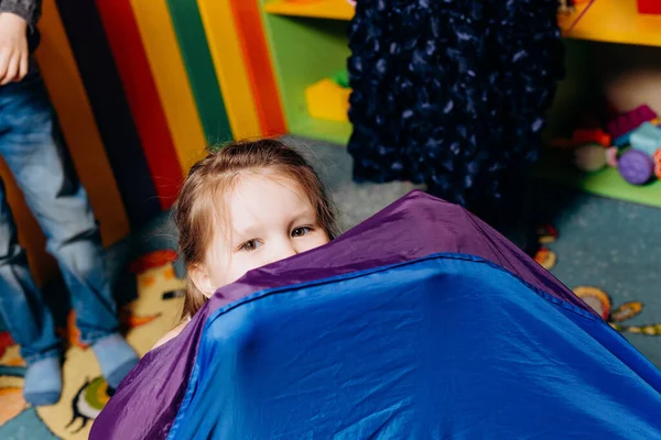 Girl Child Climb Fabric Colored Blue Purple Attraction Face Close — Fotografia de Stock