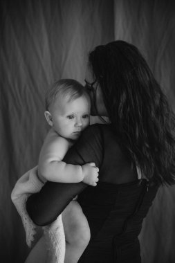 mother and newborn baby in her arms birth new life humanity light religio