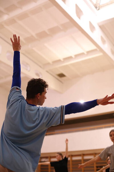 trainer man training dancing exercise with outstretched arm