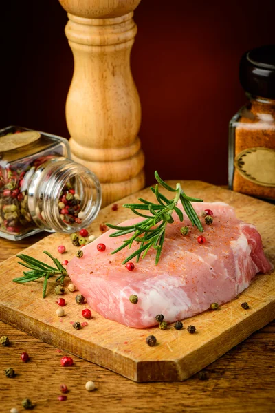 Raw pork meat and seasoning — Stock Photo, Image